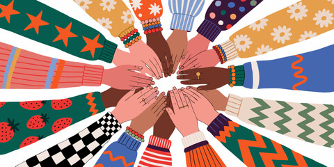 Obraz premium Diverse hands unite in colorful patterned sleeves forming a circle of unity
