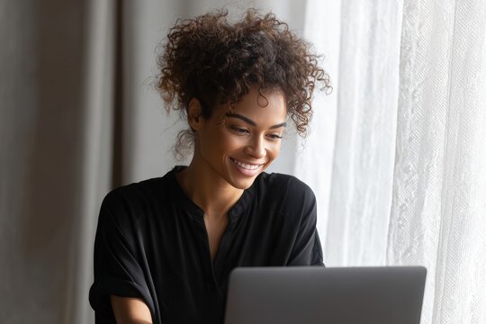 Solo remote administrative specialist smiling while sending digital reminder laptop front sheer curt