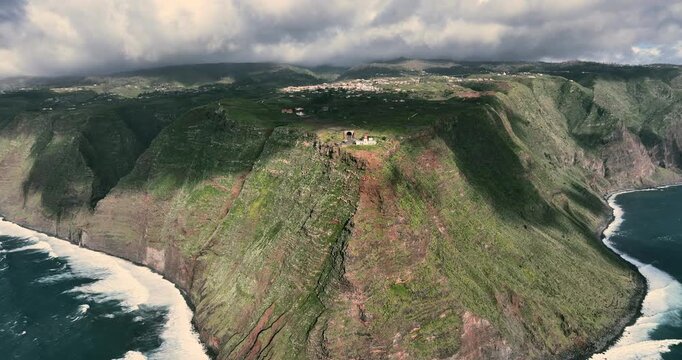 Aerial View of Ponta do Pargo Steep Cliffs and Lighthouse in Madeira island, Portugal. Spectacular seascape aerial panorama