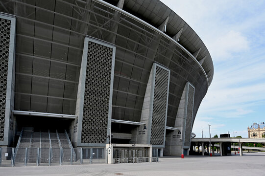 Budapest. 05.06.2026: the Puskas soccer stadium and sport centrum. concrete cladding. steel frame. metal exterior panels. clear blue summer sky. modern architecture. landmark modern new sport arena