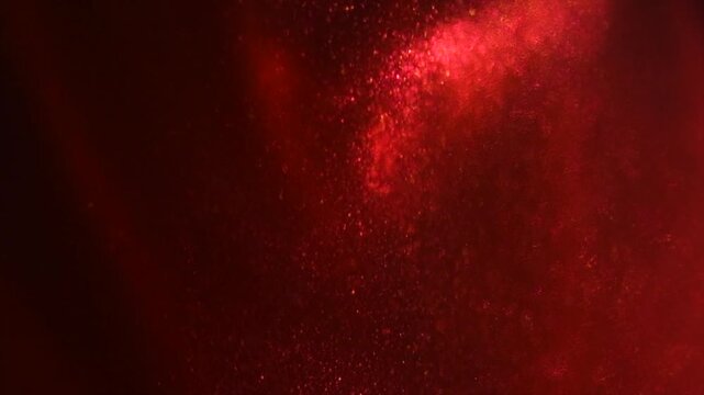 Red particles floating background, Liquid red metallic dust, abstract backdrop. Beautiful metallic dust texture, fractal, paint close-up. Art wallpaper waves surface 