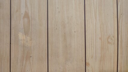 Fototapeta premium Natural light pine wood plank texture background. Clean wooden panel surface with vertical grain and knots. Rustic timber backdrop for product placement and graphic design copy space