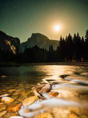 Naklejka premium Majestic Granite Peaks and Rushing River Surge