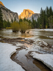 Obraz premium Majestic Granite Peaks and Rushing River Surge