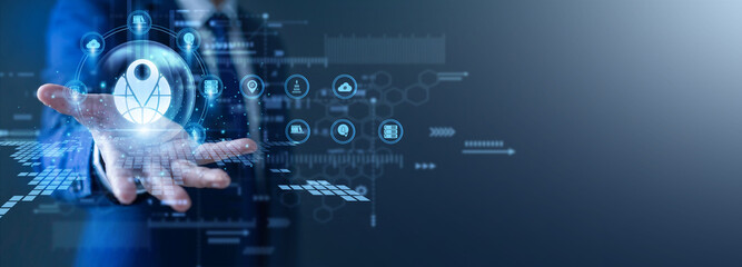 Map specialist tracks data. Technician with a glow the hand GIS network display. Spatial mapping tools provide accurate geographic visualization for urban planning and resource management. © FutureLogic Studio