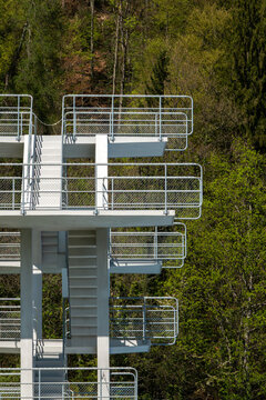Outdoor Diving Tower With Green Forest Background.