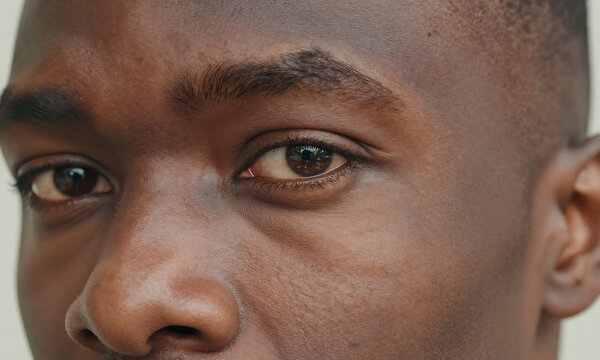 portrait african american male face angle highlighting eye details subtle skin textures soft