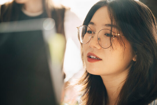 Close-up of female computer programmer working at office