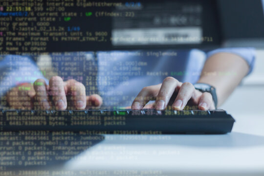 close up computer programmer man hand typing configuration on keyboard at laptop for input coding language to software for fix bug and defect of system in data center room , engineering and technology