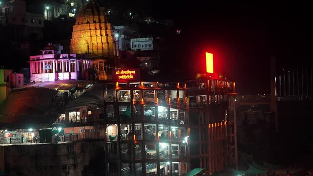 Omkareshwar Temple Night View with Neon Lights Reflection on Narmada River