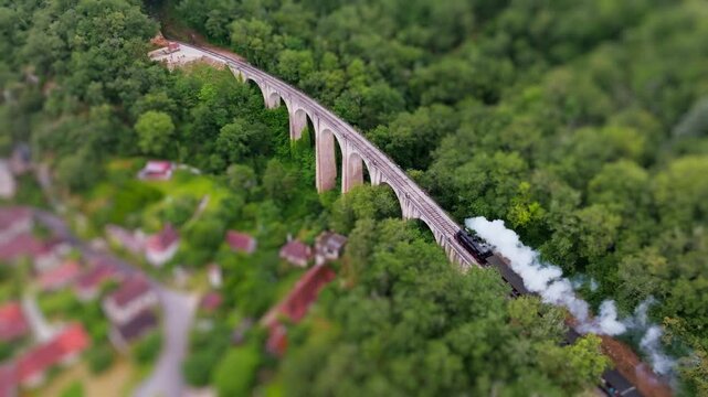 Martel Steam Train Crossing Viaduct Aerial Tilt-Shift