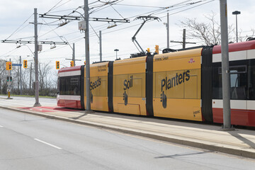 Naklejka premium Interac debit service advertising wrap on TTC trolley, The Queensway, Toronto