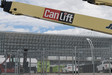 Naklejka premium CanLift equipment with defocused view of expanded BMO Field at Exhibition Place, Toronto