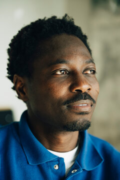 Thoughtful male entrepreneur contemplating at creative workspace
