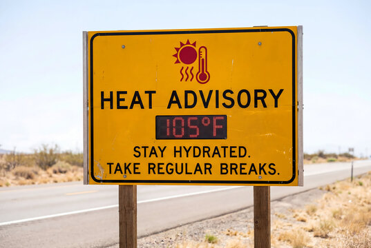 Electronic heat advisory sign showing 105 degrees Fahrenheit on road