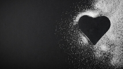 Top view of spilled sugar scattered across deep black background, creating striking contrast and minimalist composition. Large empty copy space for product placement or advertising text.  © magdal3na