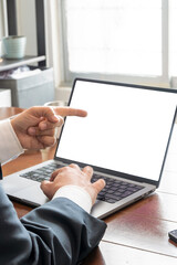 Fototapeta premium Professional businessman pointing at blank laptop screen