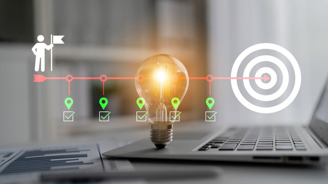 This creative image illustrates a light bulb symbolizing innovation and success, complemented by achievement icons and a target, perfect for business and strategy themes. Cyphers
