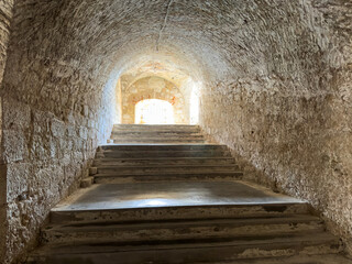 Fototapeta premium Stone vaulted staircase inside the New Fortress in Corfu Town Greece.