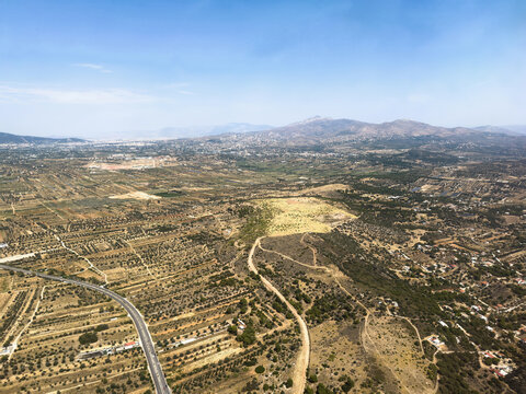 Aerial view of rural landscape and mountains near Spata area, Attica, Greece.