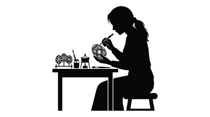 Fototapeta premium Woman painting intricate Easter egg silhouette