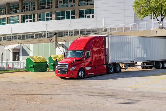 American style truck. Transport concept. Road freight cars. rucking with semitruck vehicle. Semi truck in America. Freightliner trailer transportation. Rig truck semi trailer hauling