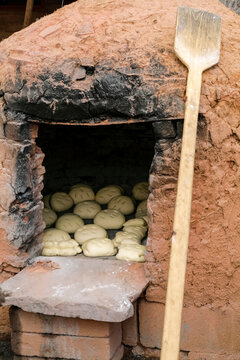 Traditional horno oven baking bread in New Mexico