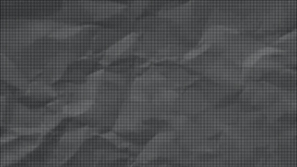 Fototapeta premium Close-up view of a dark crumpled surface with textured wrinkles