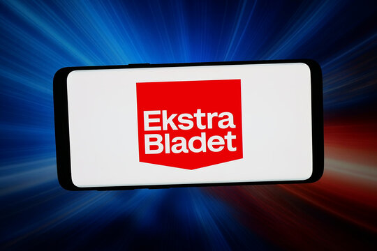 Stuttgart, Germany - 04-27-2026: In this photo illustration, the logo of Danish tabloid newspaper Ekstra Bladet is displayed on a smartphone in front of abstract background on computer screen.