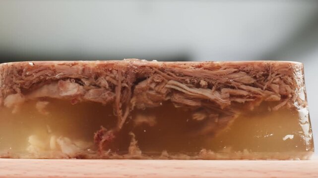 Meat aspic, slavic food, Traditional Russian pork meat aspic Kholodets with horseradish, mustard, jellied jelly beef, eating in restaurant chicken tasty dish. Close up on kitchen. 