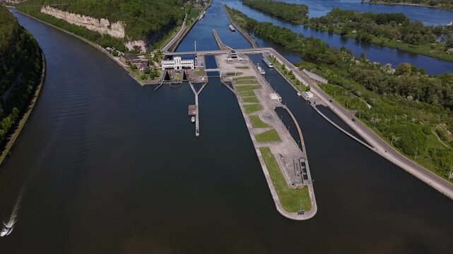 Lock on River Maas near Maastricht shows the Ecluse de Lanaye and barge passing through