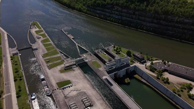 View of lock on River Maas near Maastricht as barge passes through Ecluse de Lanaye