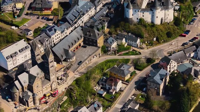 A panoramic Aerial view of the city and castle Clervaux in Luxembourg, on a sunny spring noon