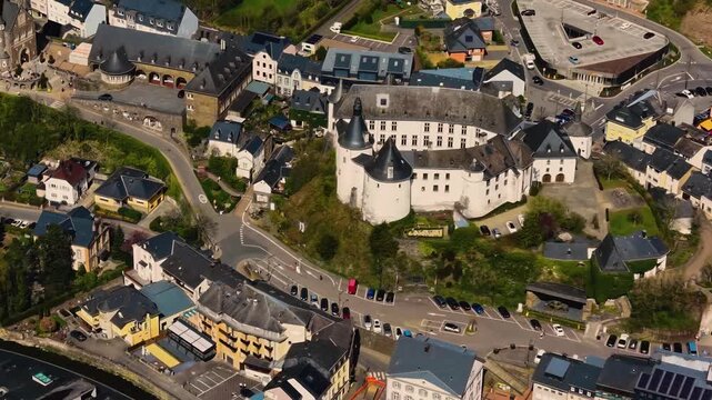 A panoramic Aerial view of the city and castle Clervaux in Luxembourg, on a sunny spring noon