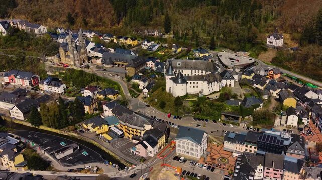 A panoramic Aerial view of the city and castle Clervaux in Luxembourg, on a sunny spring noon