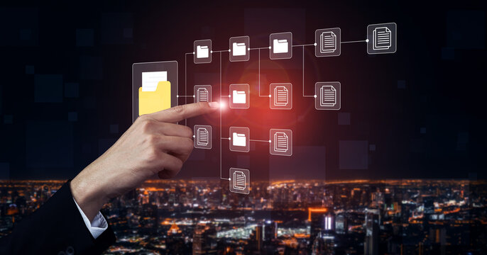 A professional hand interacts with a virtual display of file sharing and data management against a vibrant city skyline at night, symbolizing innovation in technology and organization. Cyphers