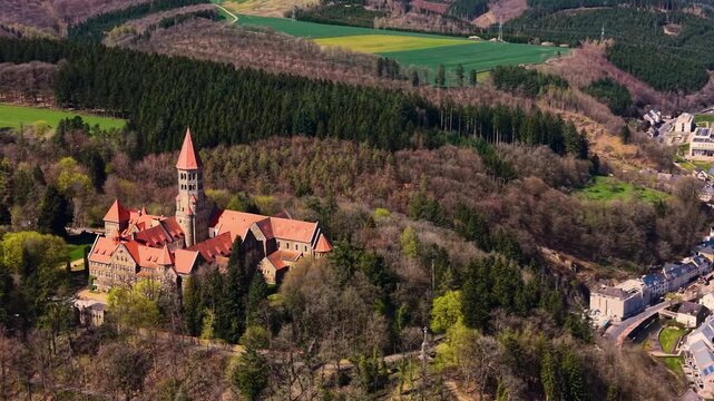 A panoramic Aerial view of the city and castle Clervaux in Luxembourg, on a sunny spring noon