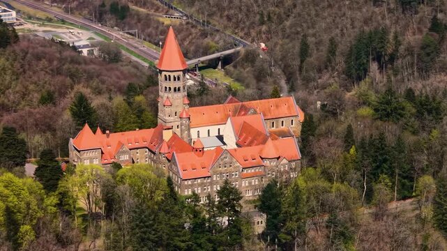 A panoramic Aerial view of the city and castle Clervaux in Luxembourg, on a sunny spring noon