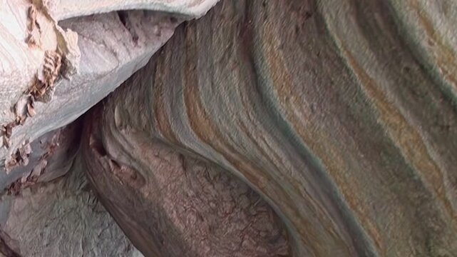 Explore the captivating Marble Caves, a geological masterpiece in Patagonia. Witness nature's artistry as light dances on the smooth, colorful, sculpted rock formations, revealing intricate patterns.