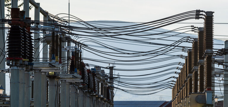 High Voltage Electrical Substation Infrastructure with Power Grid Equipment. . Industrial energy distribution network and electricity grid infrastructure.