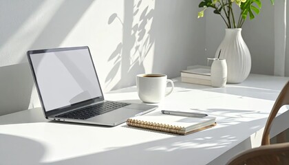 Fototapeta premium Modern workspace setup with laptop coffee notepad and decorative items
