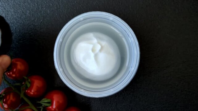 Fresh white burrata cheese with tomatoes for a salad. Burrata cheese as a food background for your design