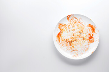 Obraz premium One dirty plate on white background, top view. Space for text