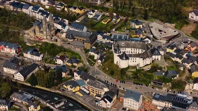 A panoramic Aerial view of the city and castle Clervaux in Luxembourg, on a sunny spring noon