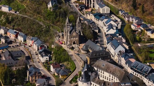 A panoramic Aerial view of the city and castle Clervaux in Luxembourg, on a sunny spring noon