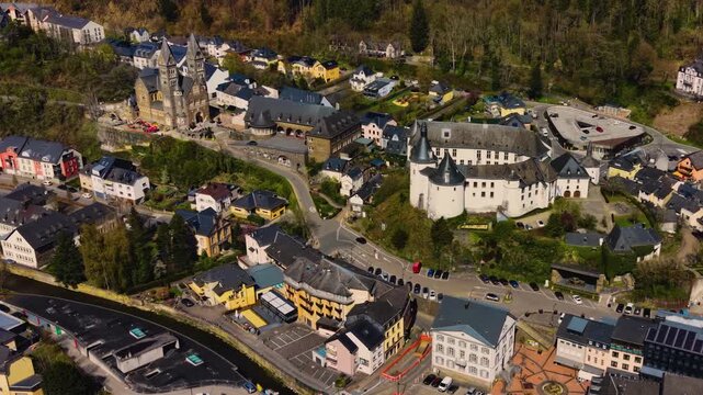 A panoramic Aerial view of the city and castle Clervaux in Luxembourg, on a sunny spring noon