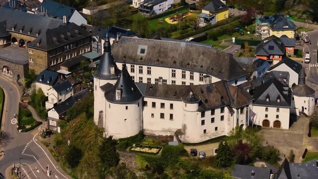 A panoramic Aerial view of the city and castle  Clervaux in Luxembourg, on a sunny spring noon