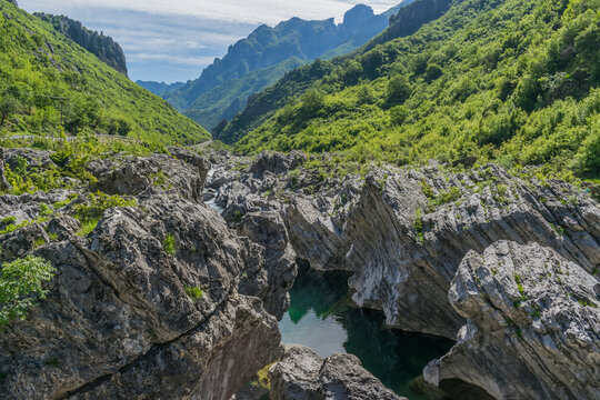 Kiri River landscape with turquoise water, rocks and mountains in the Shkoder region of Albania