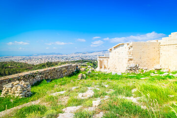 Naklejka premium Erechtheion temple with green grass in Acropolis of Athens, Greece