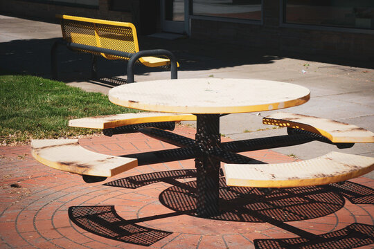 Retro table and bench in urban courtyard